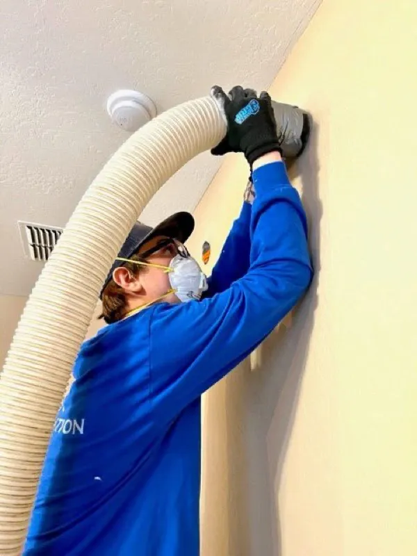 Interior sound-barrier wall drill-and-fill insulation in an Apache Junction home