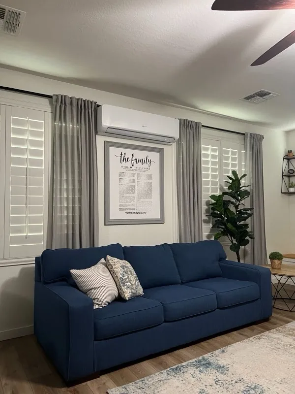 Ductless mini-split head mounted on a living room wall in a Gilbert home