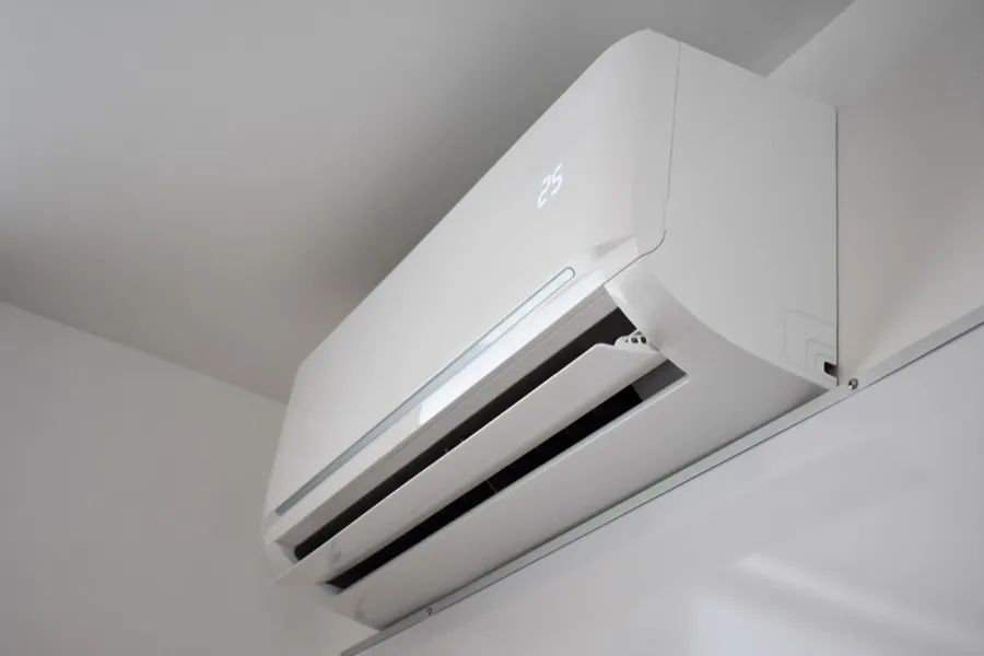 A wall-mounted ductless mini-split indoor head running in an Arizona room.