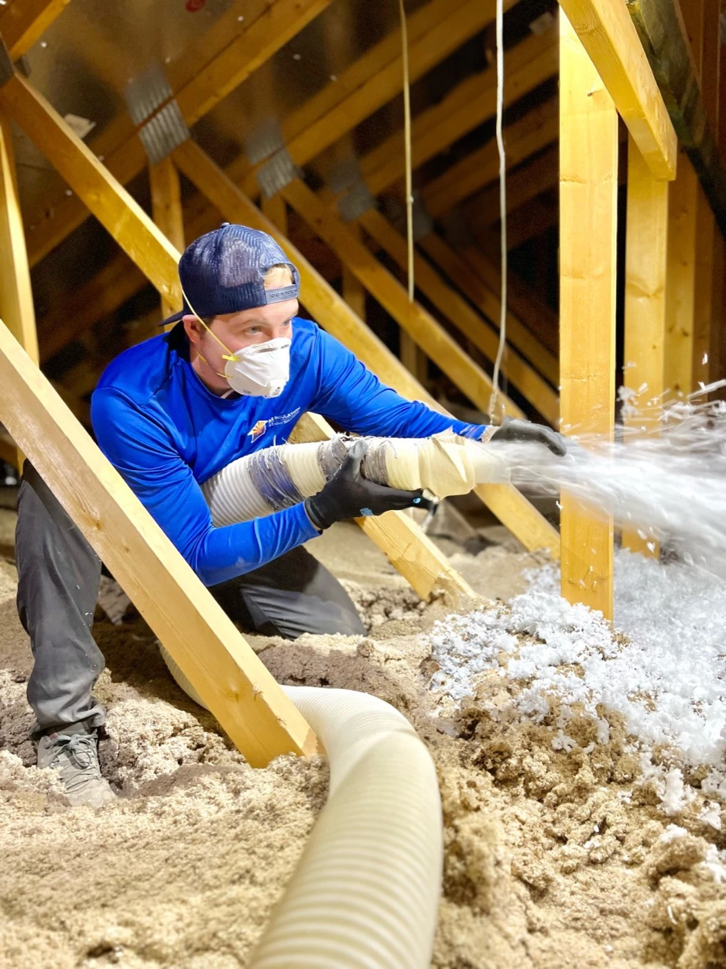 Blown-in attic insulation being installed to lower an SRP electric bill in an Arizona home