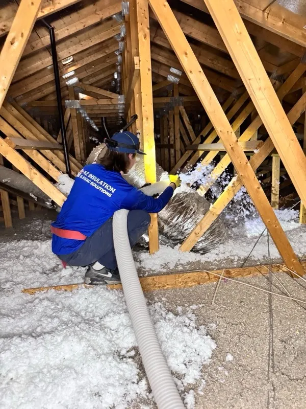 AZ Insulation technician blowing R-38 attic insulation in a Tempe home with an SRP rebate discount